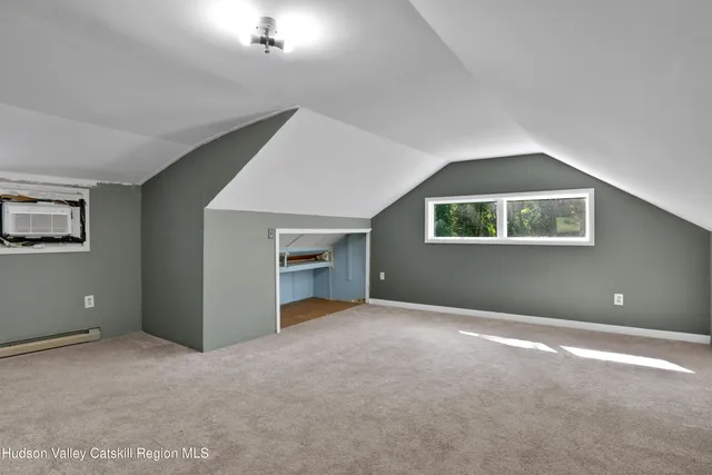 a backyard of a house with lots of green space and fountain in the back