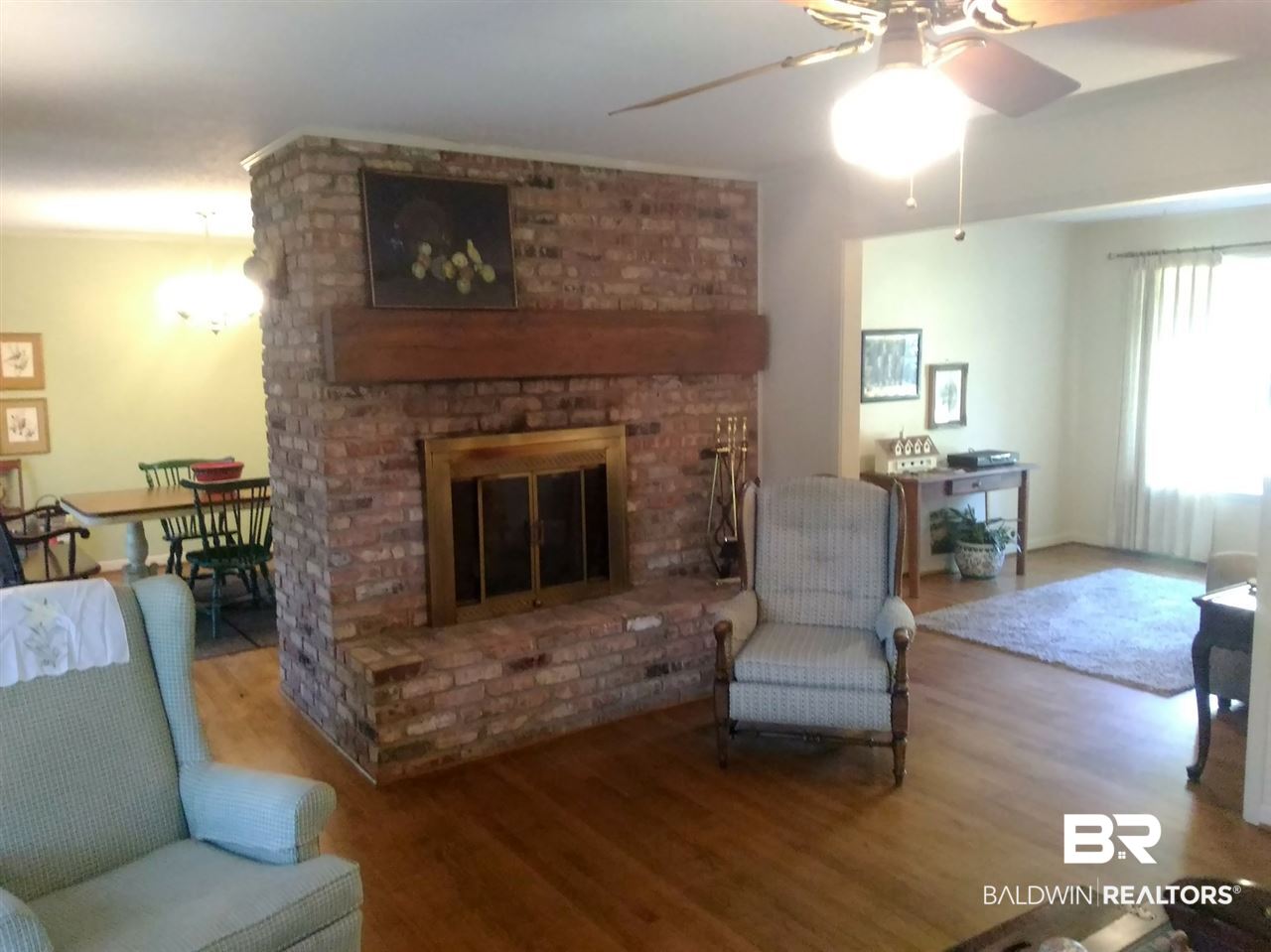 8189 River Road North Foley, AL 36535 - Photo 13 of 50 LR fireplace, formal dining and other dining.
