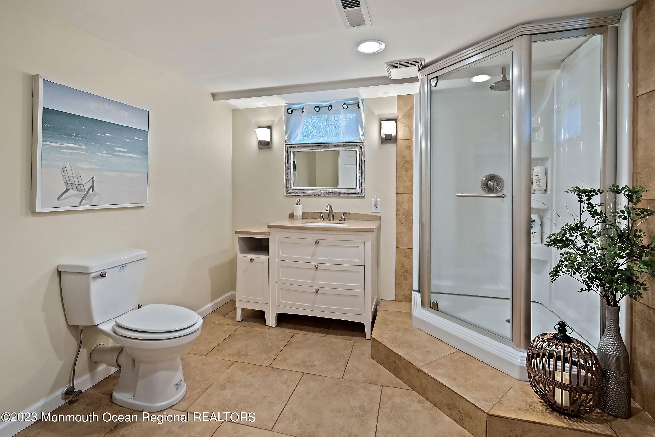 554 Hopping Road Belford, NJ 07718 - Photo 17 of 26 a bathroom with a toilet and a shower