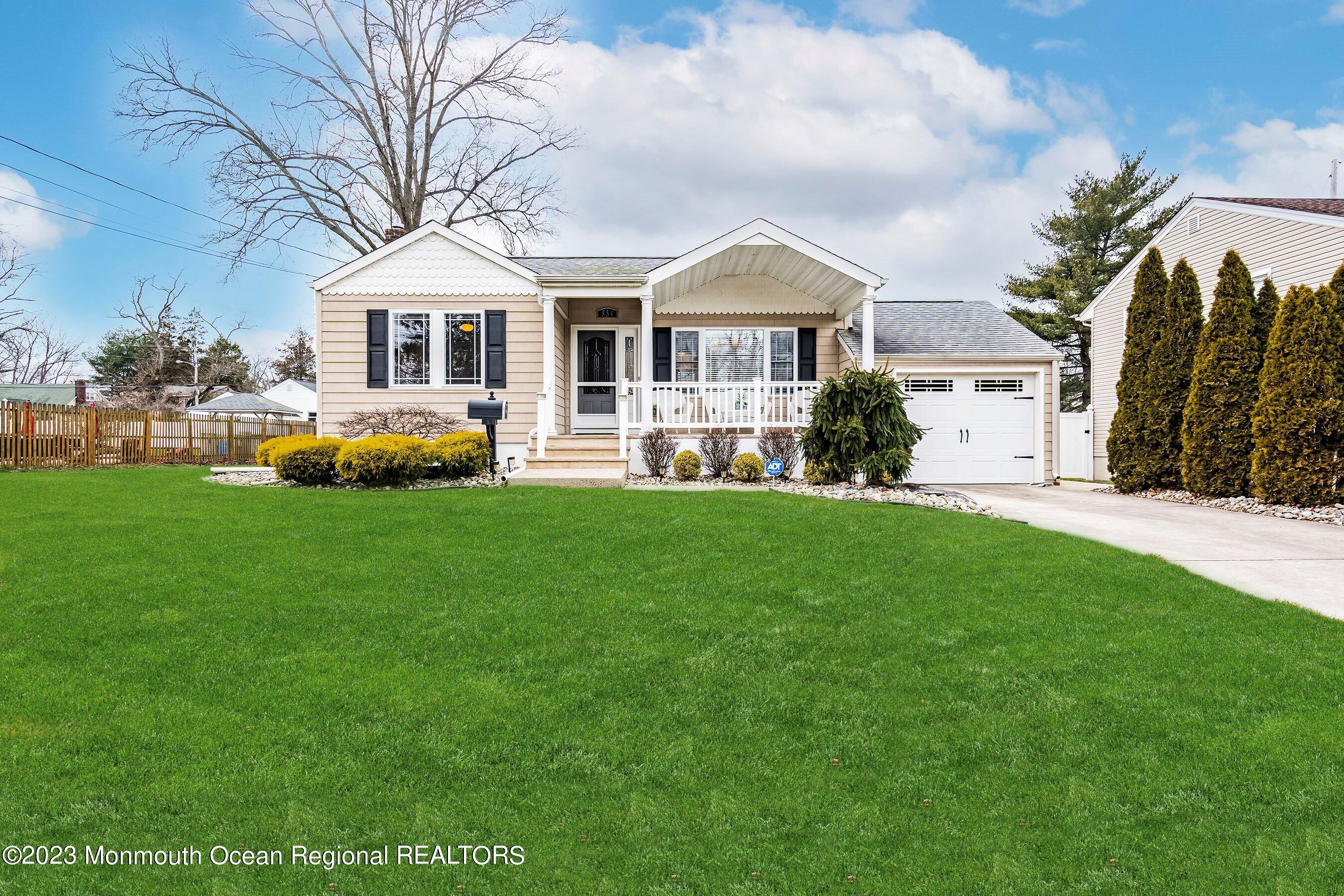 554 Hopping Road Belford, NJ 07718 - Photo 2 of 26 a front view of a house with a yard porch and sitting area