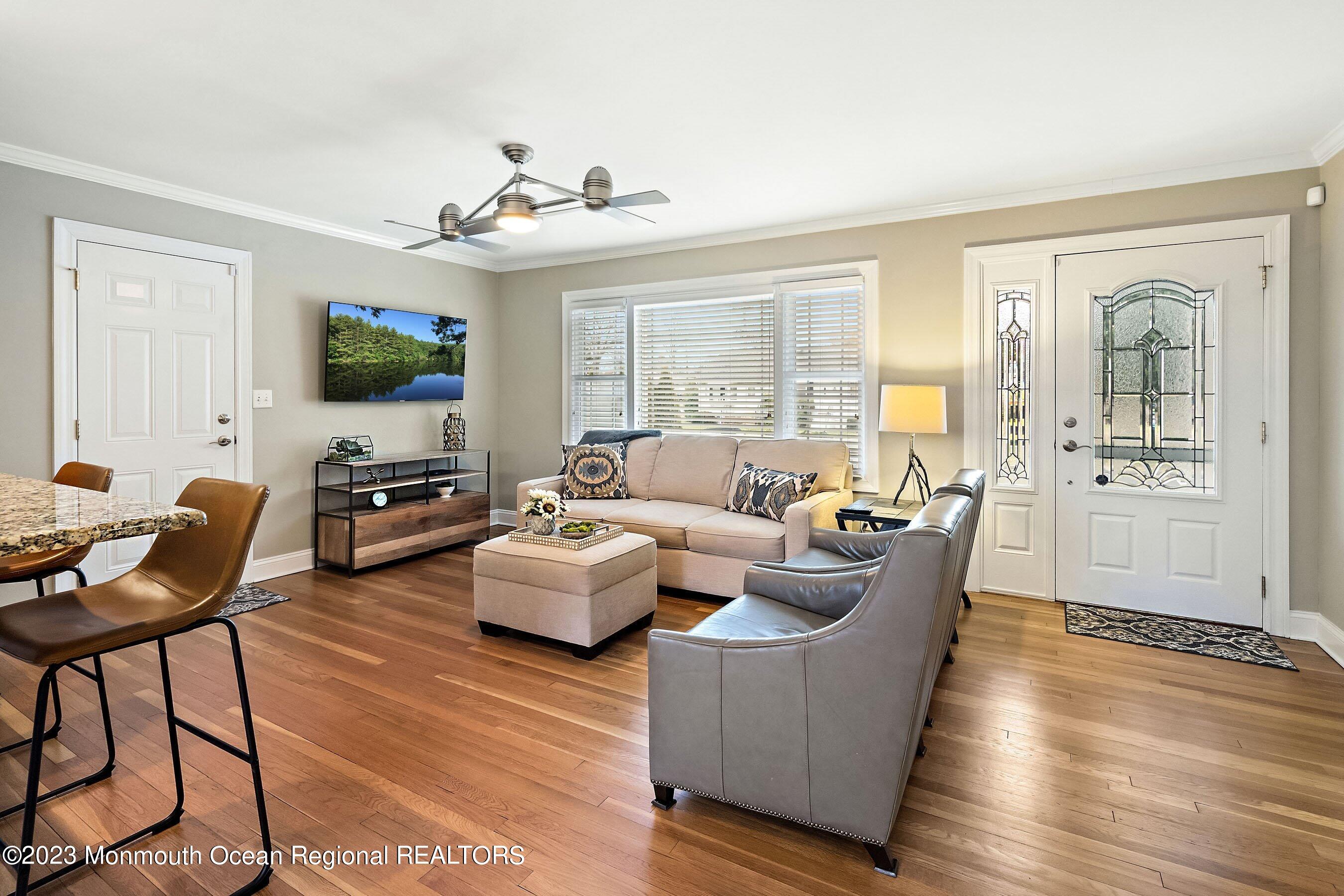 554 Hopping Road Belford, NJ 07718 - Photo 6 of 26 a living room with fireplace furniture and a flat screen tv