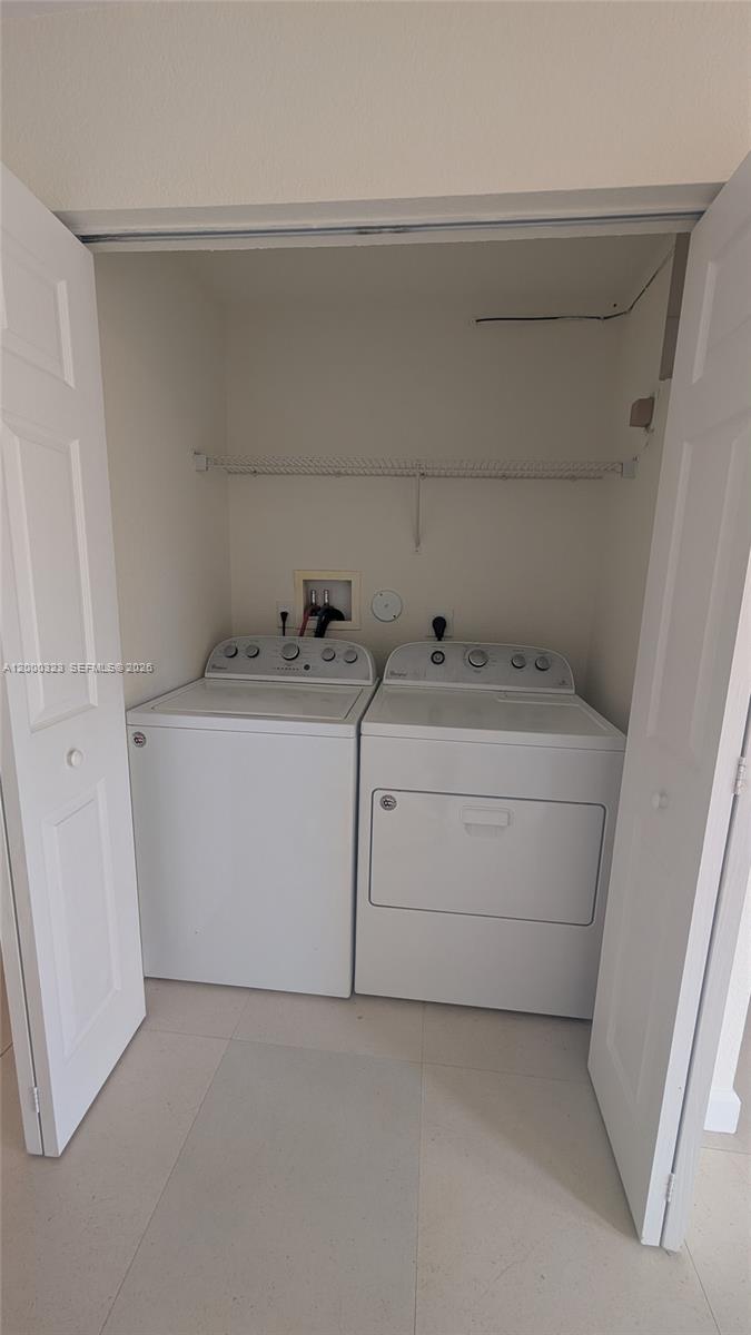 5910 Royal Way Tamarac, FL 33321 - Photo 11 of 36 a utility room with dryer and washer