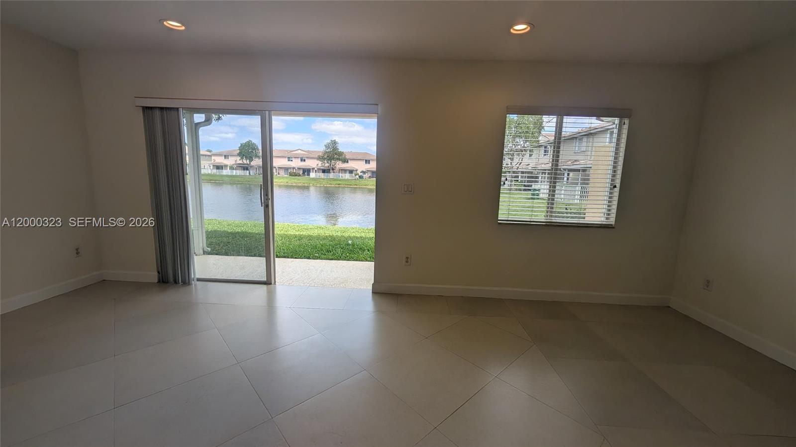 5910 Royal Way Tamarac, FL 33321 - Photo 17 of 36 an empty room with windows