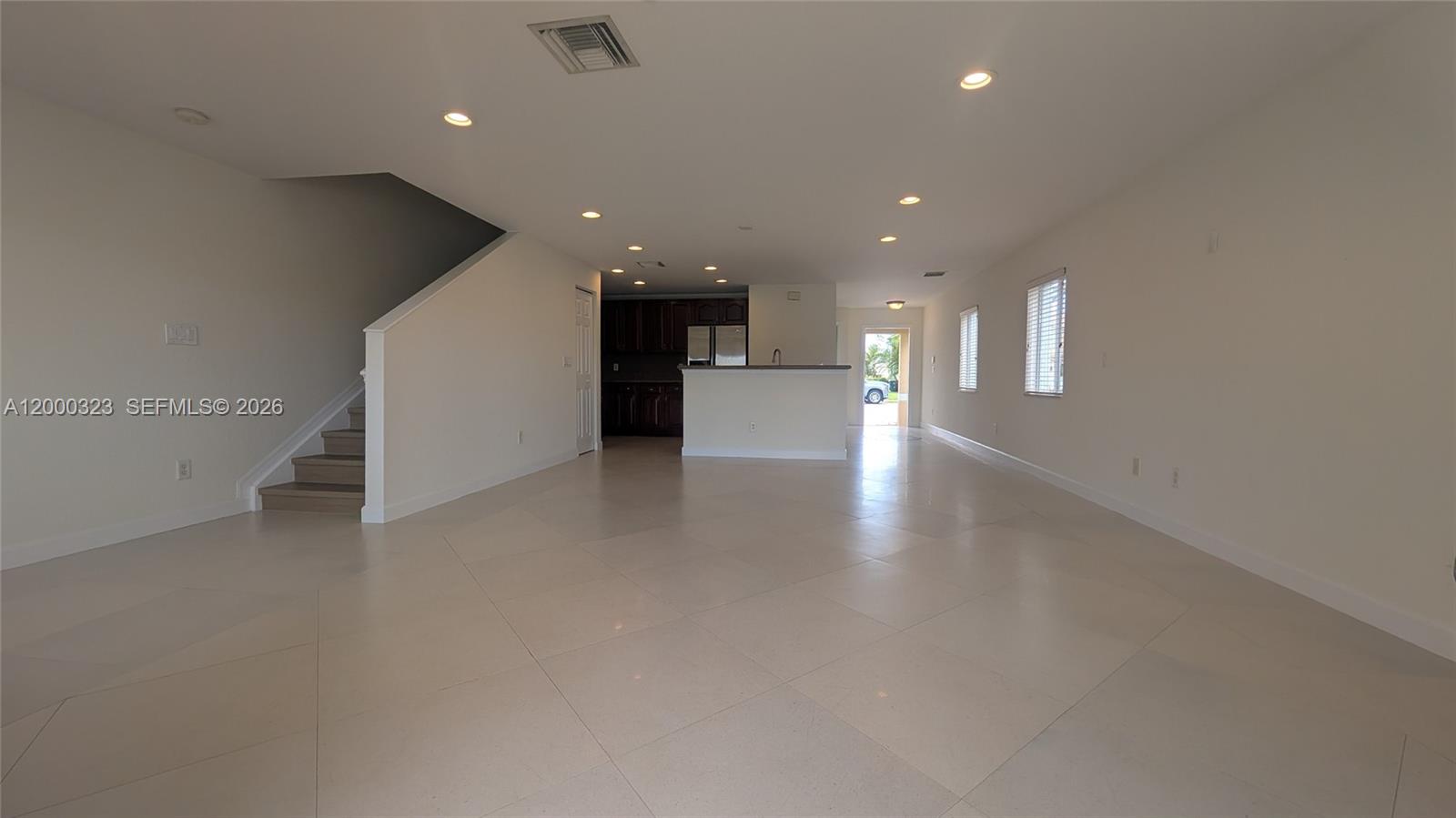 5910 Royal Way Tamarac, FL 33321 - Photo 19 of 36 a view of a hallway with stairs