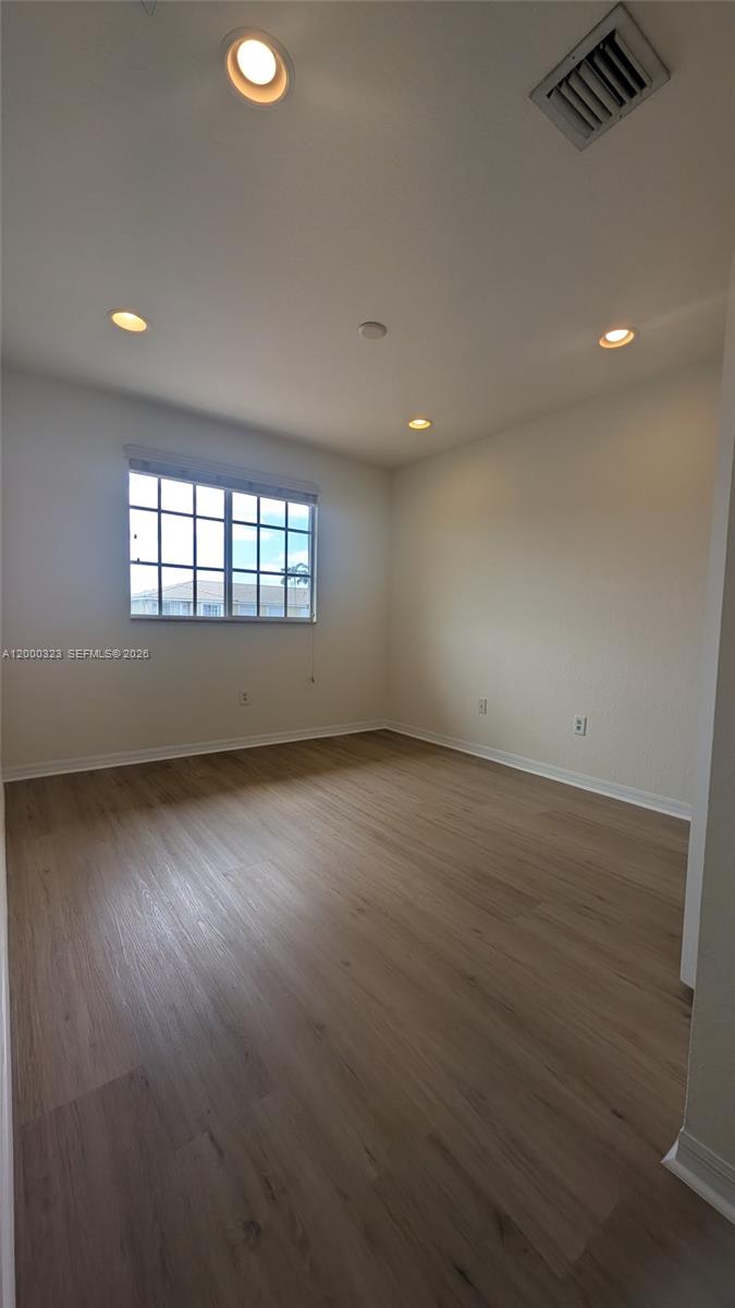 5910 Royal Way Tamarac, FL 33321 - Photo 22 of 36 an empty room with a empty space and windows