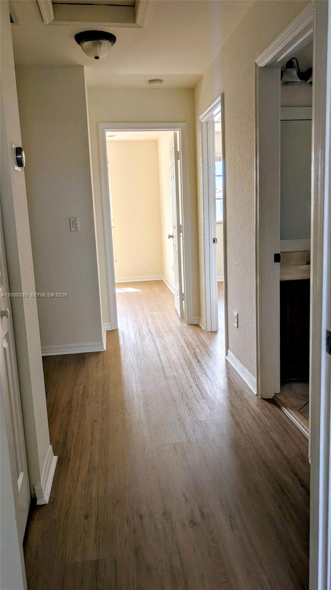 5910 Royal Way Tamarac, FL 33321 - Photo 27 of 36 an empty room with wooden floor and closet