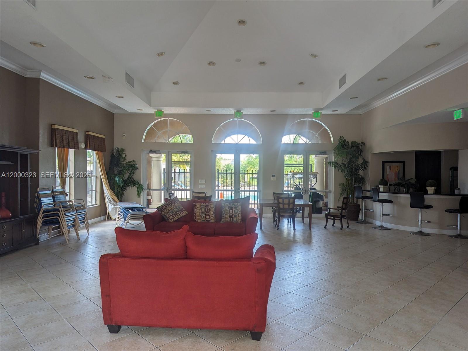 5910 Royal Way Tamarac, FL 33321 - Photo 33 of 36 a living room with furniture and a large window