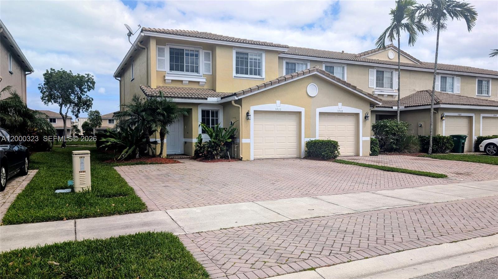 5910 Royal Way Tamarac, FL 33321 - Photo 35 of 36 a front view of a house with a yard