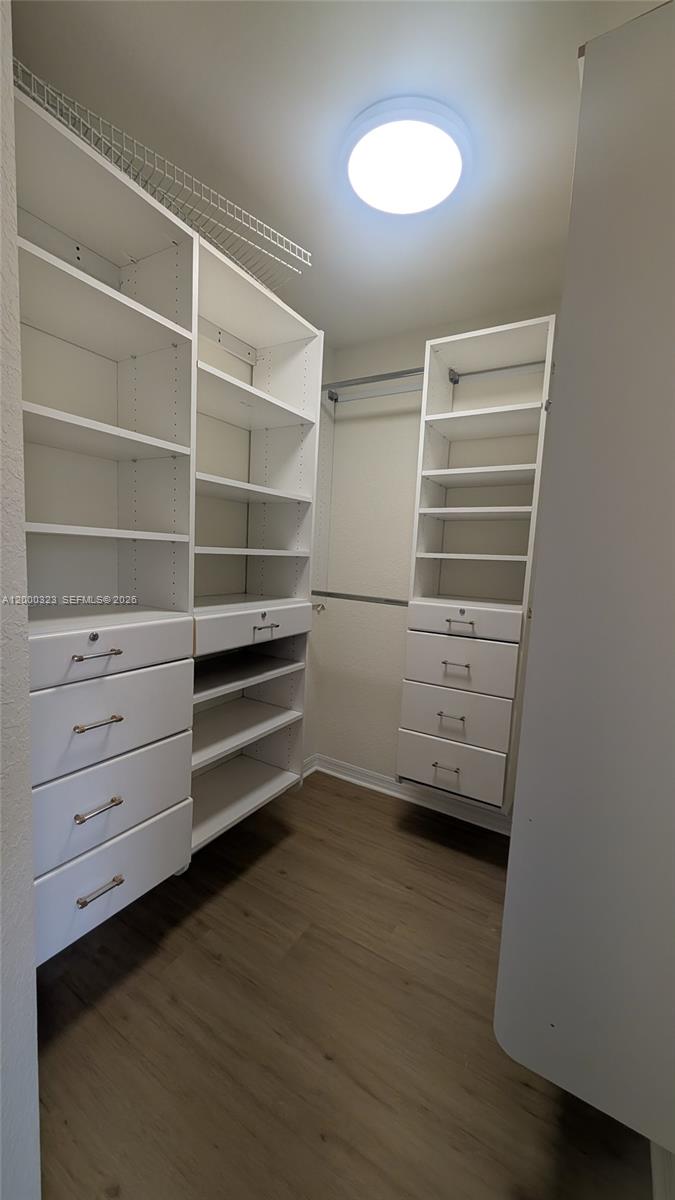 5910 Royal Way Tamarac, FL 33321 - Photo 7 of 36 a view of walk in closet with empty racks