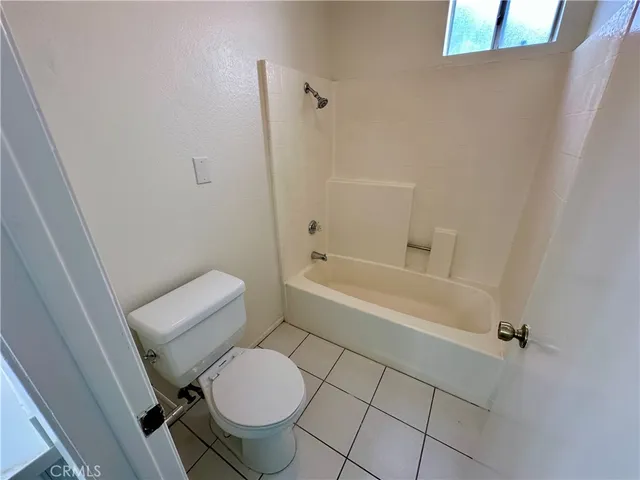 a spacious bathroom with a double vanity sink and a mirror