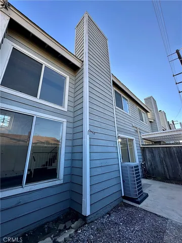 a view of a room with a wooden fence
