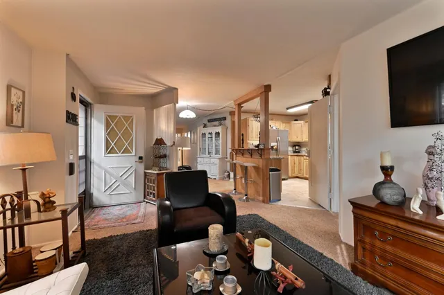 a kitchen with stainless steel appliances granite countertop a stove a refrigerator and a microwave