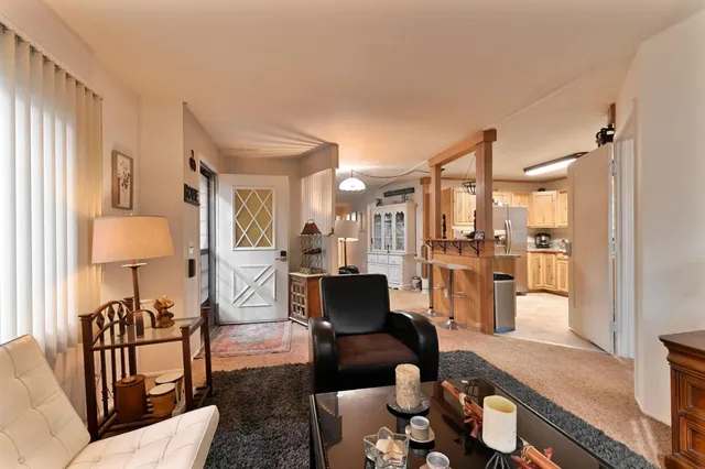 a modern kitchen with stainless steel appliances granite countertop a refrigerator and a sink
