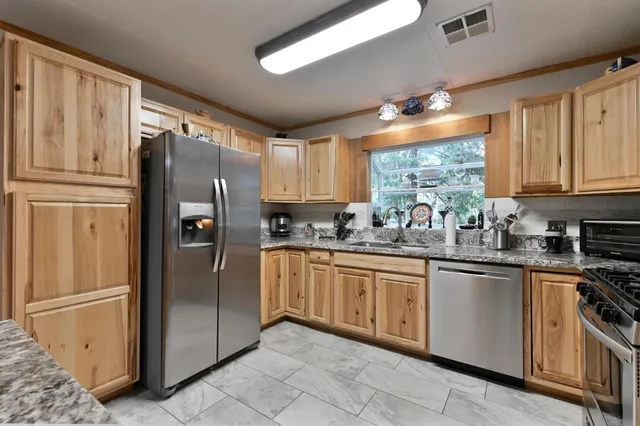 a view of a dining room and livingroom with furniture