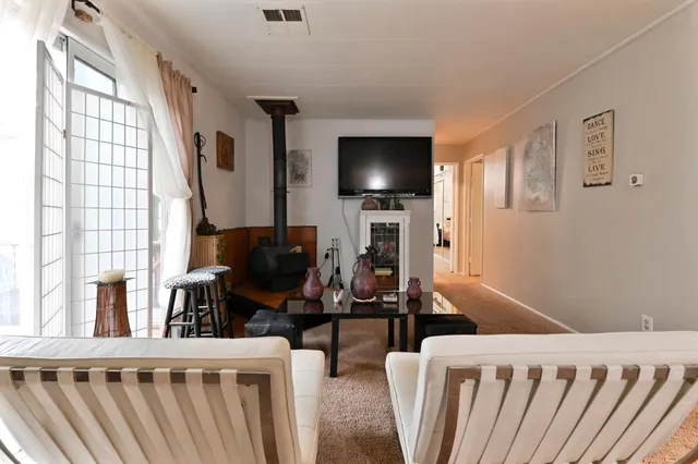 a bedroom with a bed and a television