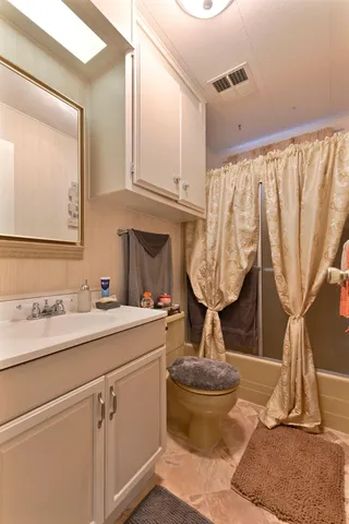 a bathroom with a toilet and a sink