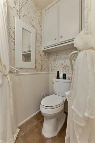 a view of outdoor space with deck and trees