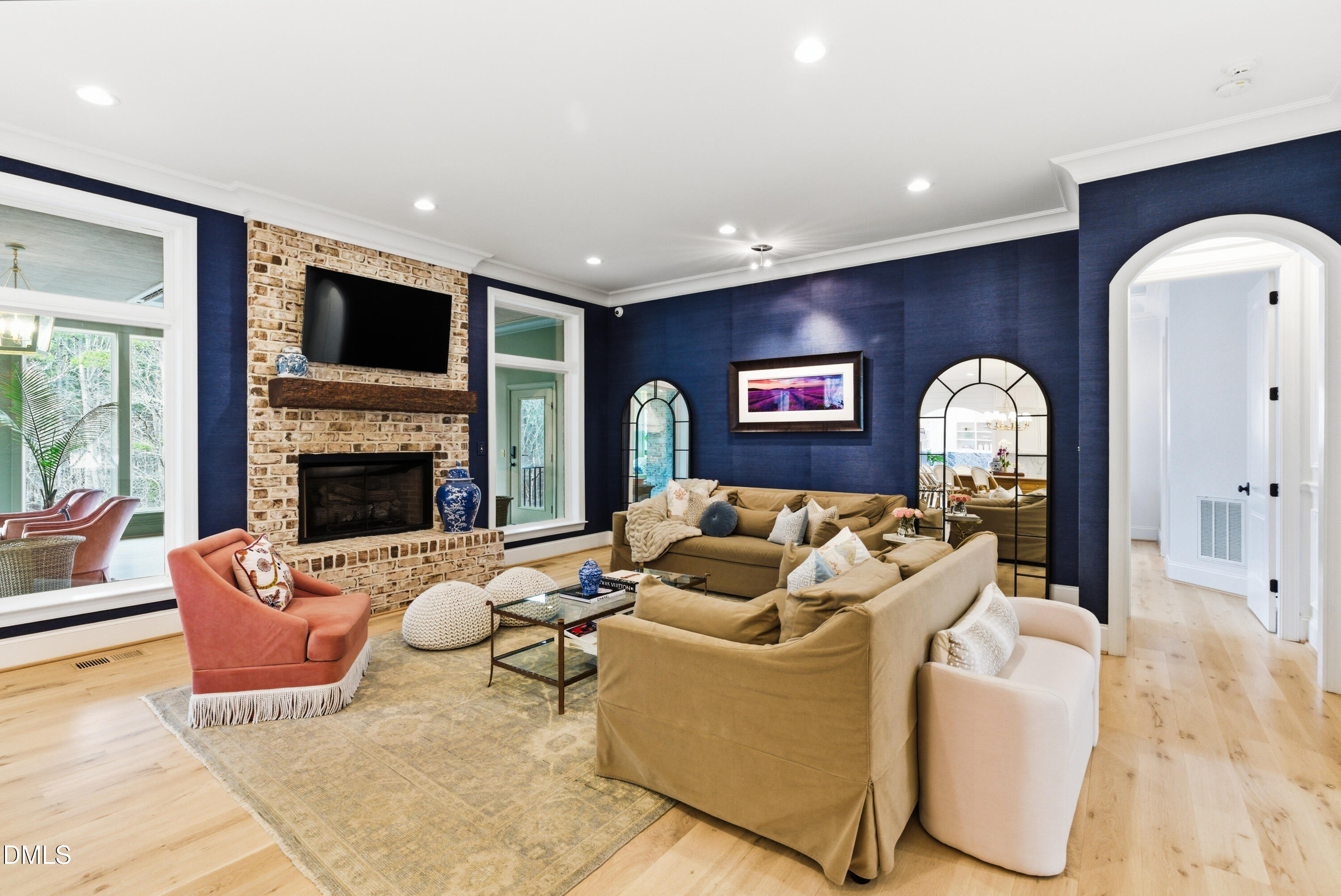 1528 Eglantyne Court Raleigh, NC 27613 - Photo 20 of 99 a living room with furniture fireplace and a flat screen tv