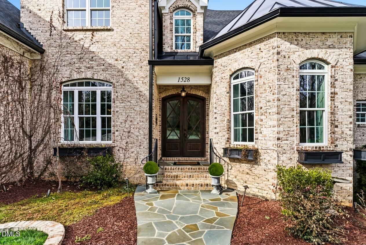 1528 Eglantyne Court Raleigh, NC 27613 - Photo 2 of 99 a front view of a house with a yard