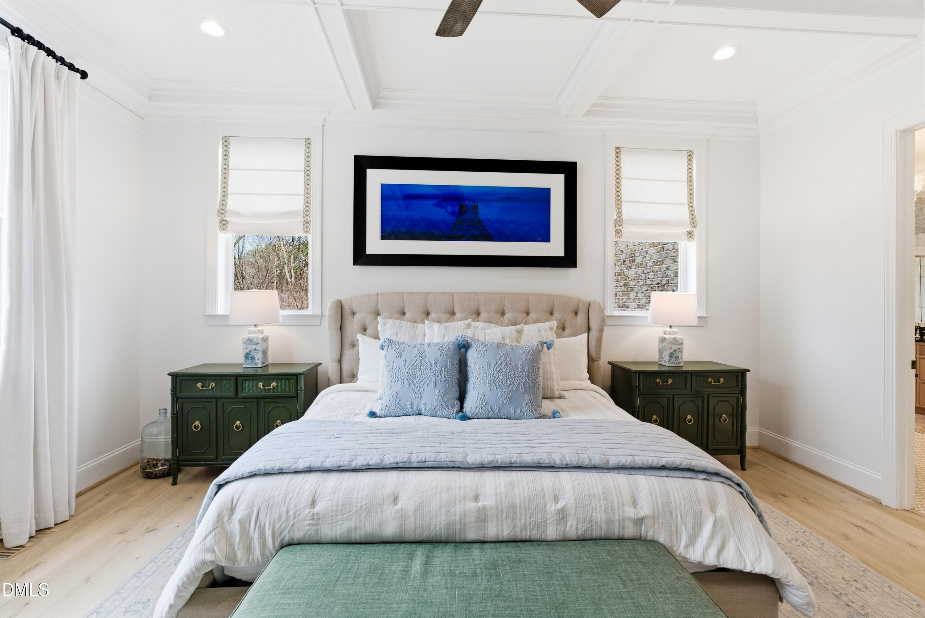 1528 Eglantyne Court Raleigh, NC 27613 - Photo 39 of 99 a bedroom with a large bed and a chandelier