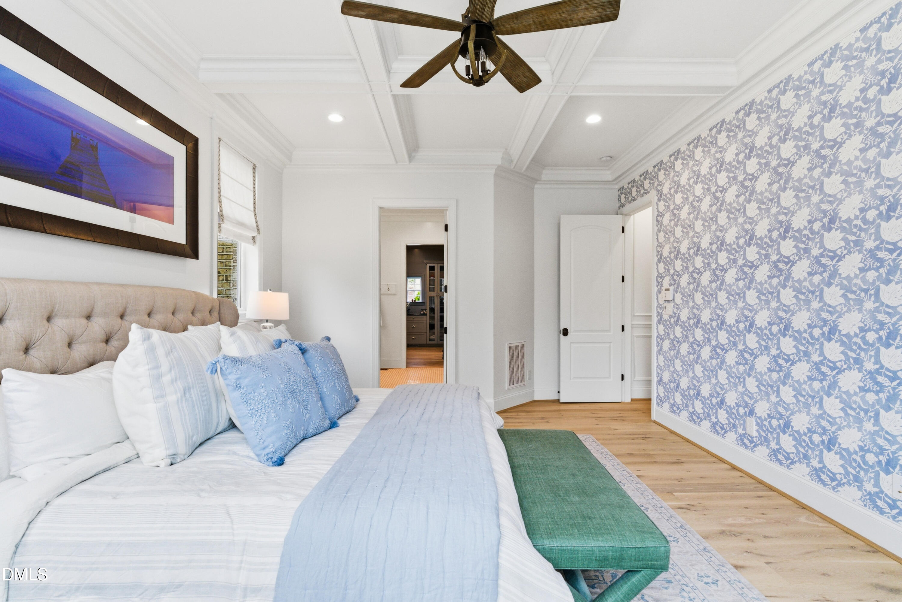 1528 Eglantyne Court Raleigh, NC 27613 - Photo 40 of 99 a spacious bedroom with a bed and a chandelier