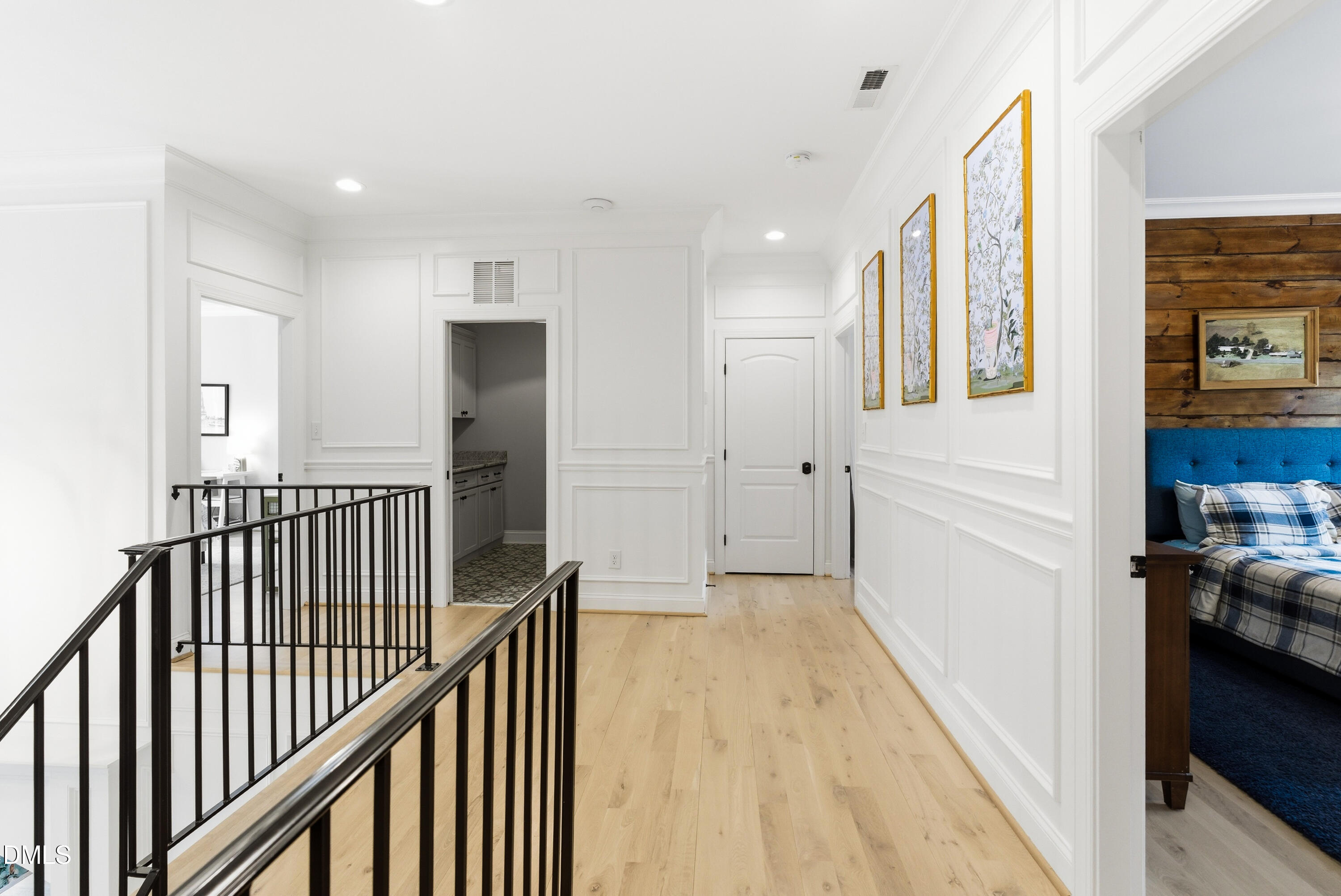 1528 Eglantyne Court Raleigh, NC 27613 - Photo 64 of 99 a view of a hallway with wooden floor and staircase