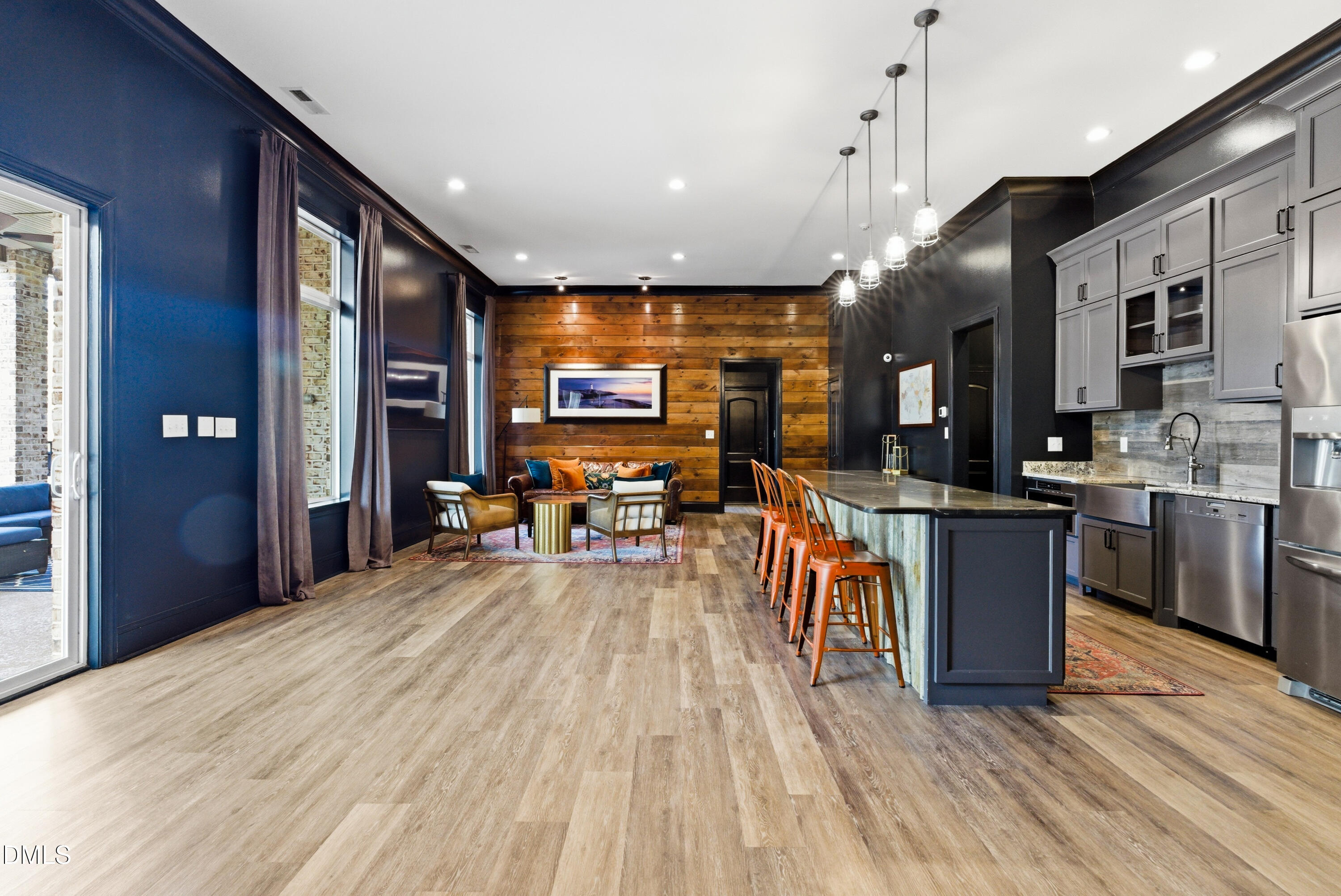 1528 Eglantyne Court Raleigh, NC 27613 - Photo 67 of 99 a view of a kitchen with kitchen island a counter top space a sink stainless steel appliances and cabinets