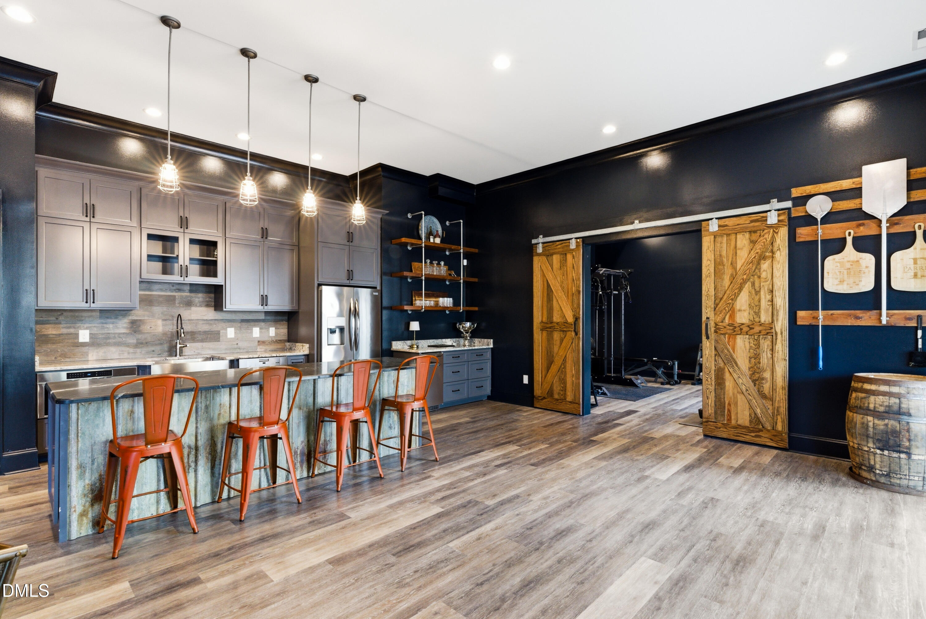 1528 Eglantyne Court Raleigh, NC 27613 - Photo 69 of 99 a open kitchen with stainless steel appliances kitchen island granite countertop a table chairs and a refrigerator