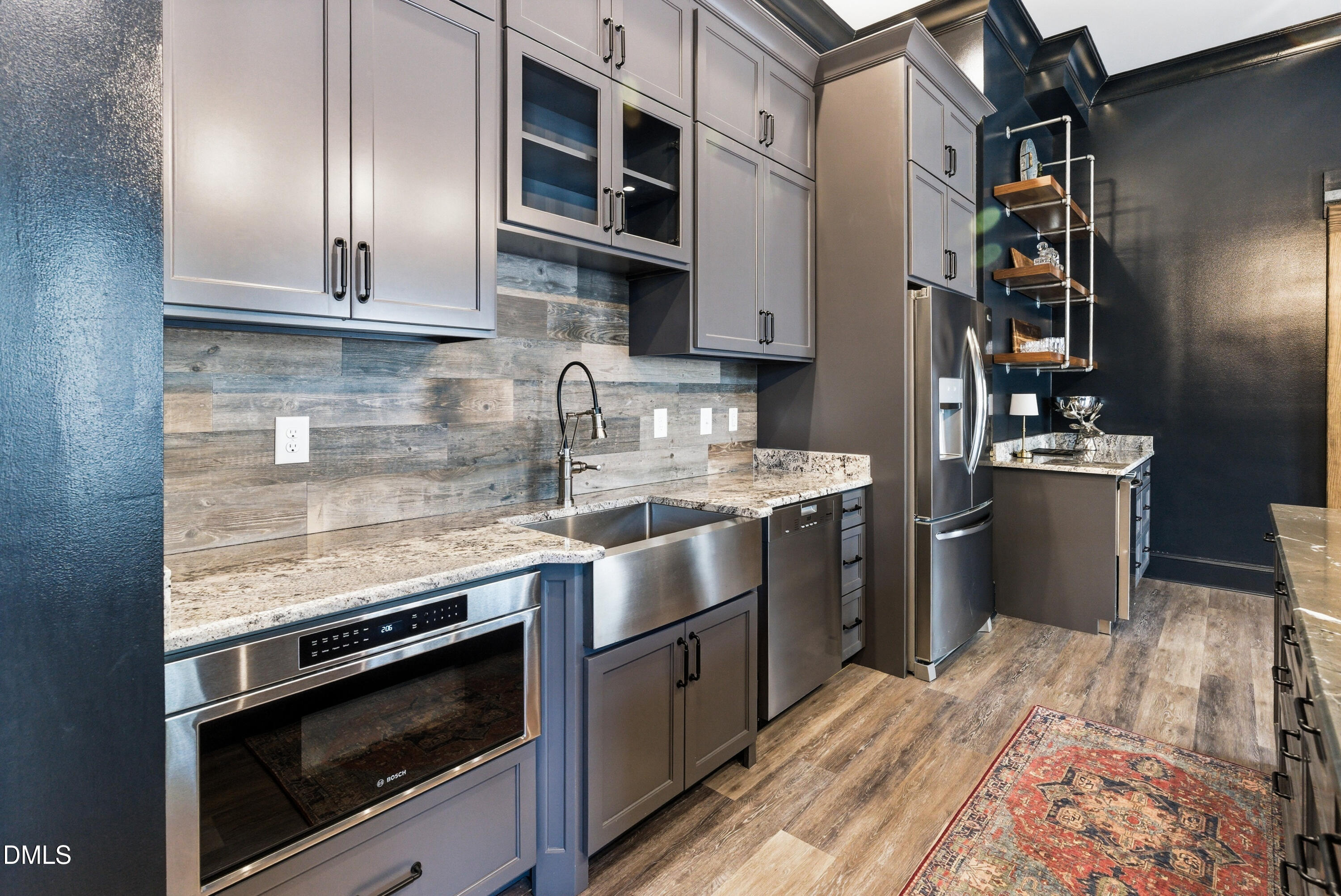 1528 Eglantyne Court Raleigh, NC 27613 - Photo 70 of 99 a kitchen with stainless steel appliances granite countertop a sink stove and refrigerator