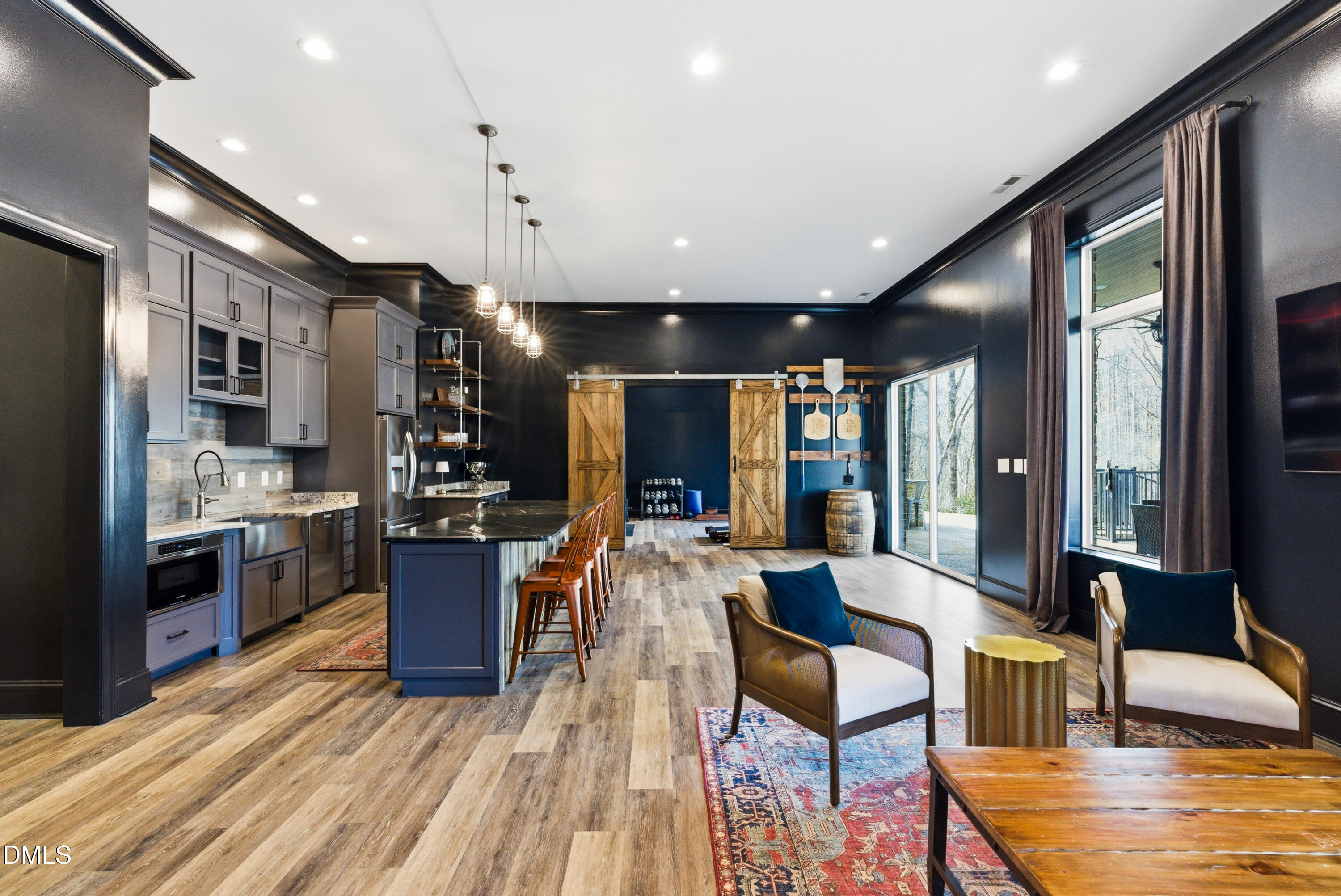 1528 Eglantyne Court Raleigh, NC 27613 - Photo 73 of 99 a large kitchen with stainless steel appliances kitchen island granite countertop a large cabinets a sink and a counter top space