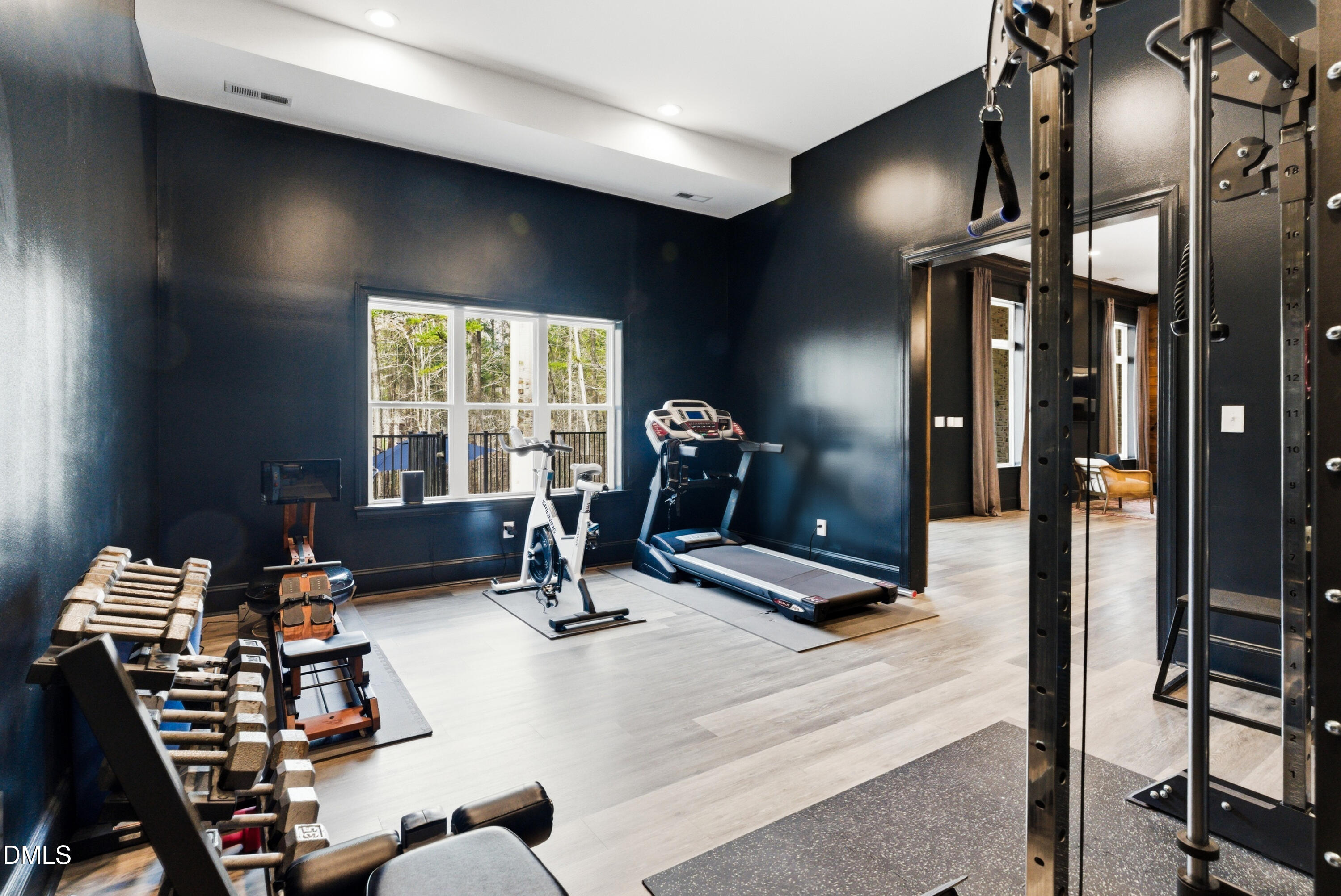 1528 Eglantyne Court Raleigh, NC 27613 - Photo 77 of 99 a room with gym equipment and a large window