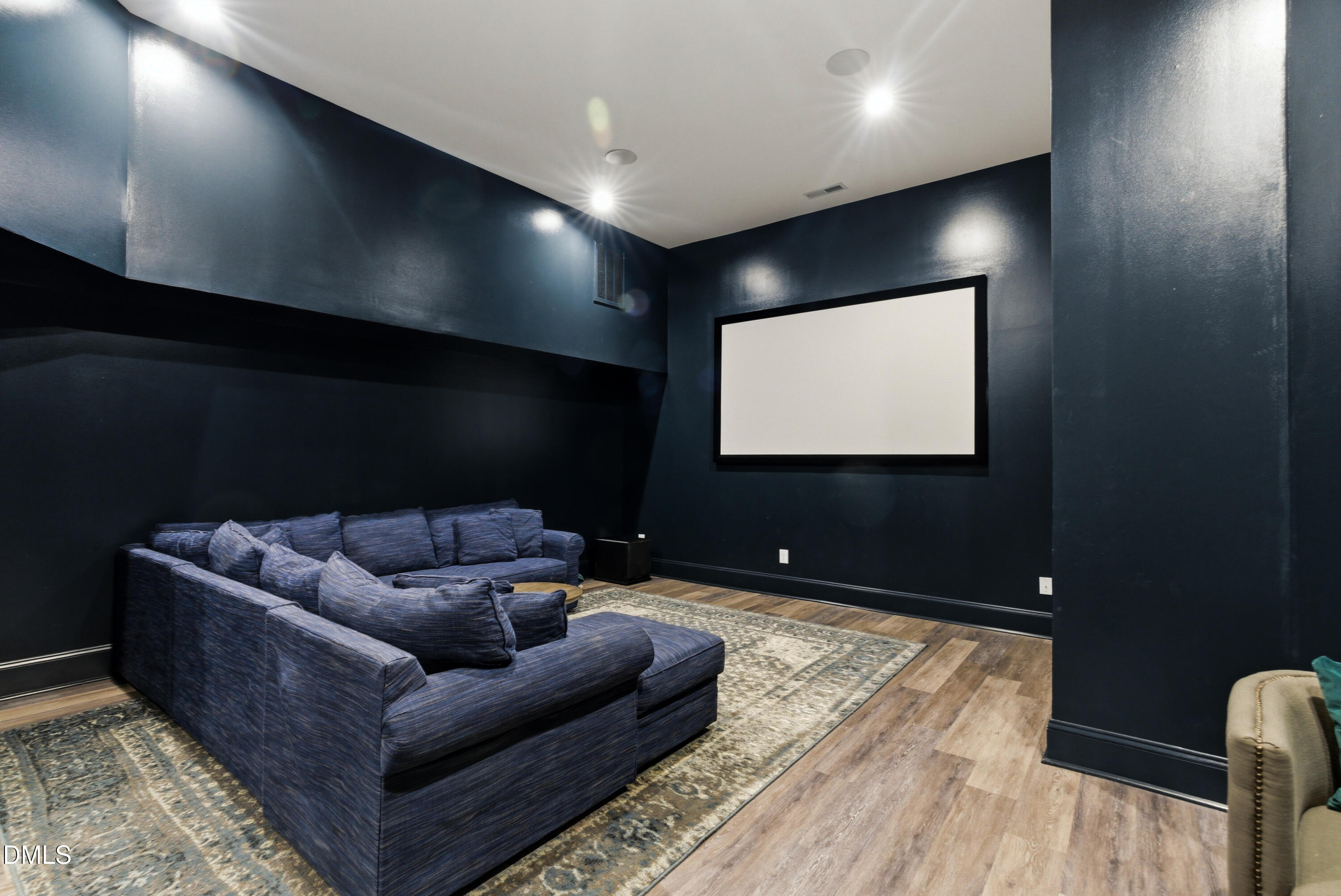 1528 Eglantyne Court Raleigh, NC 27613 - Photo 80 of 99 a living room with furniture and a flat screen tv