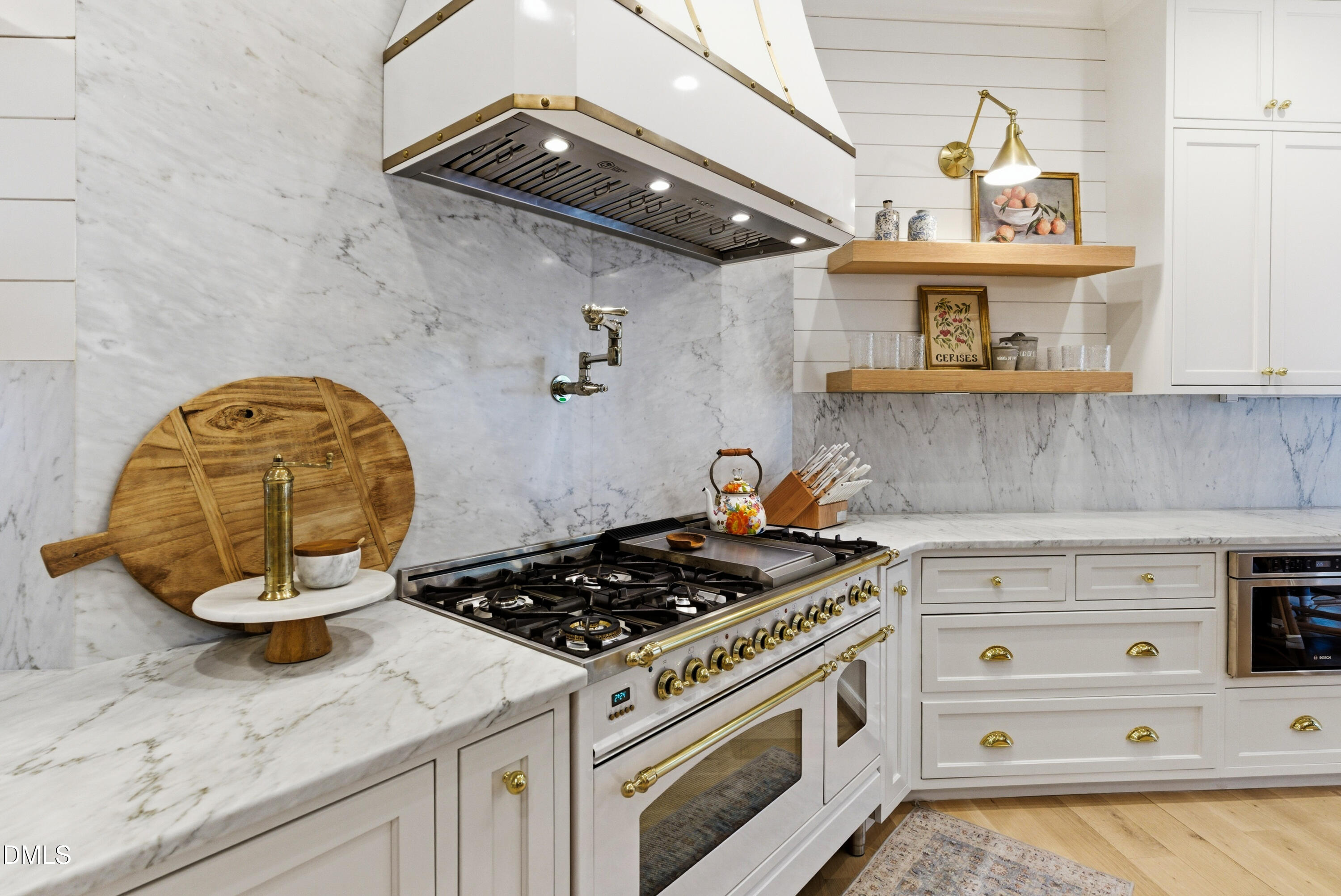 1528 Eglantyne Court Raleigh, NC 27613 - Photo 8 of 99 a kitchen with stainless steel appliances granite countertop a stove and a sink