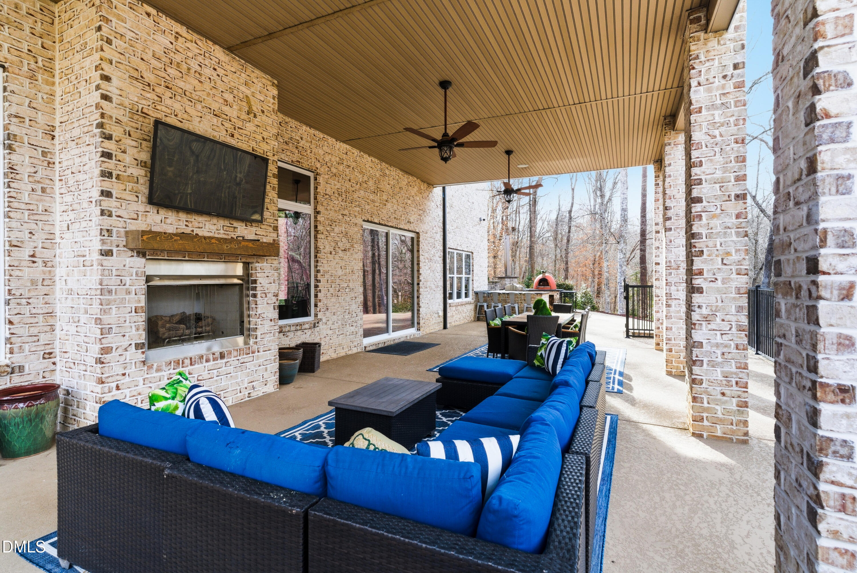 1528 Eglantyne Court Raleigh, NC 27613 - Photo 83 of 99 a living room with furniture a flat screen tv and a fireplace