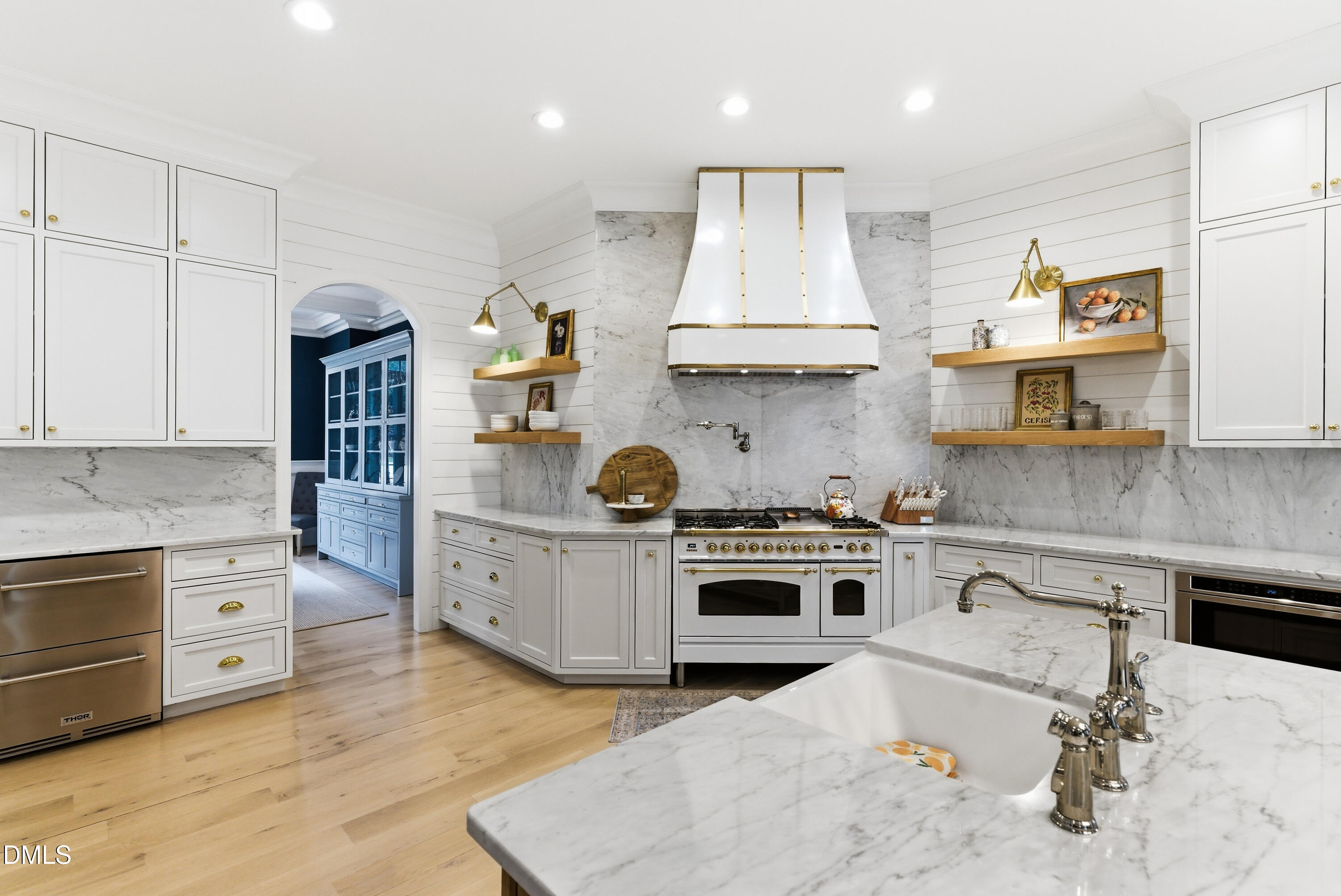 1528 Eglantyne Court Raleigh, NC 27613 - Photo 9 of 99 a kitchen with stainless steel appliances granite countertop a stove oven and a white cabinets