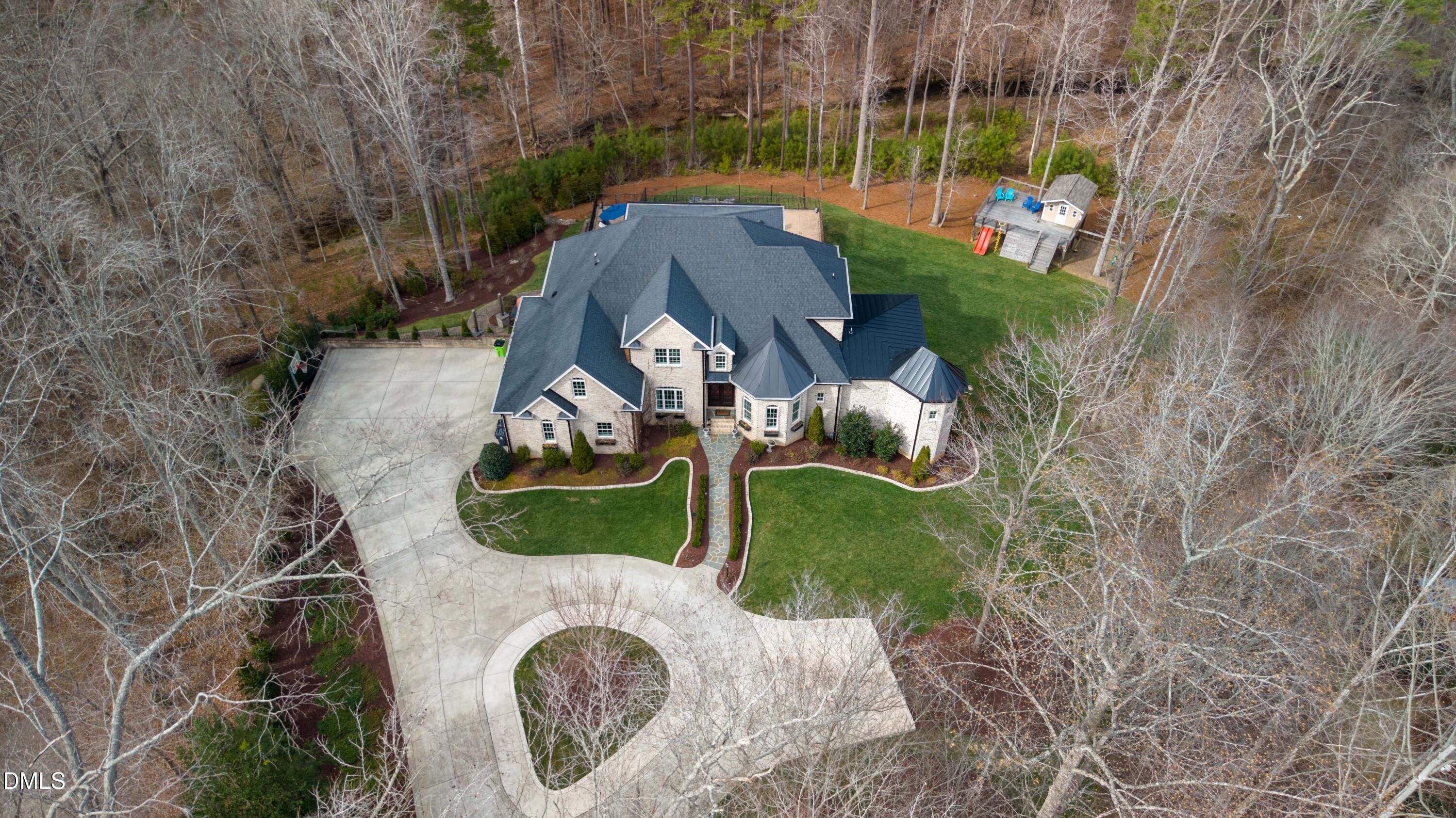 1528 Eglantyne Court Raleigh, NC 27613 - Photo 94 of 99 an aerial view of a house with a yard and lake view