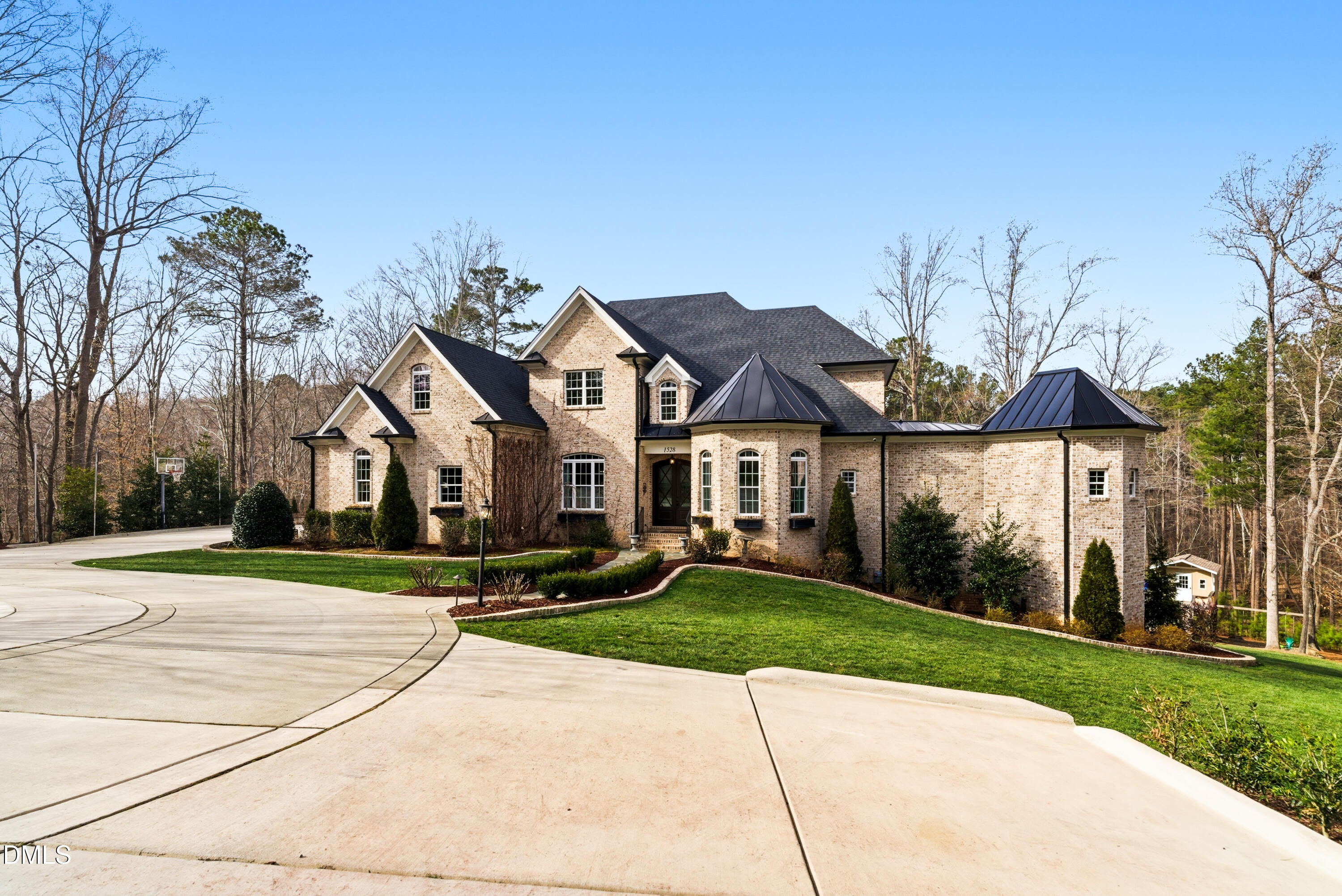 1528 Eglantyne Court Raleigh, NC 27613 - Photo 96 of 99 a front view of a house with a yard and potted plants