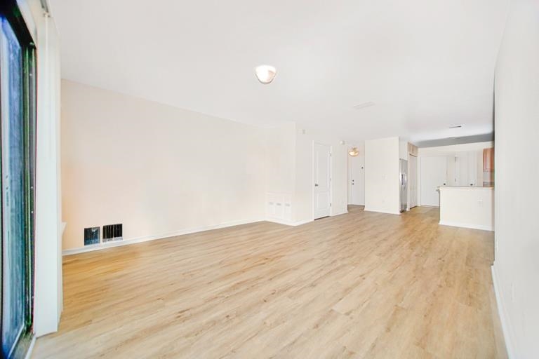 499 Cabernet Place St. Augustine, FL 32084 - Photo 26 of 30 a view of empty room with wooden floor and fan