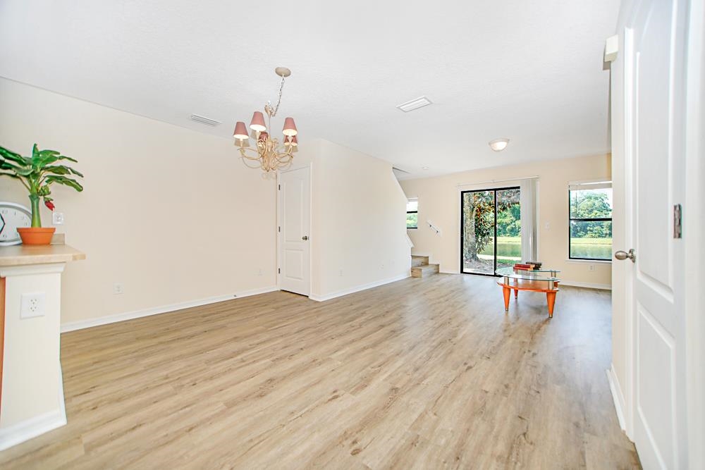 499 Cabernet Place St. Augustine, FL 32084 - Photo 5 of 30 a view of a room with wooden floor and potted plant