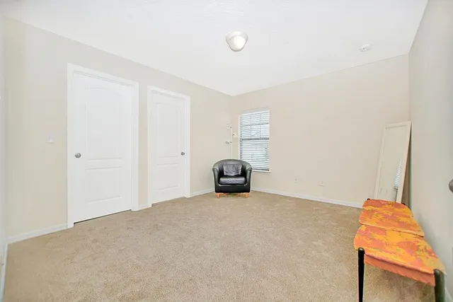 a big room with closet and natural light