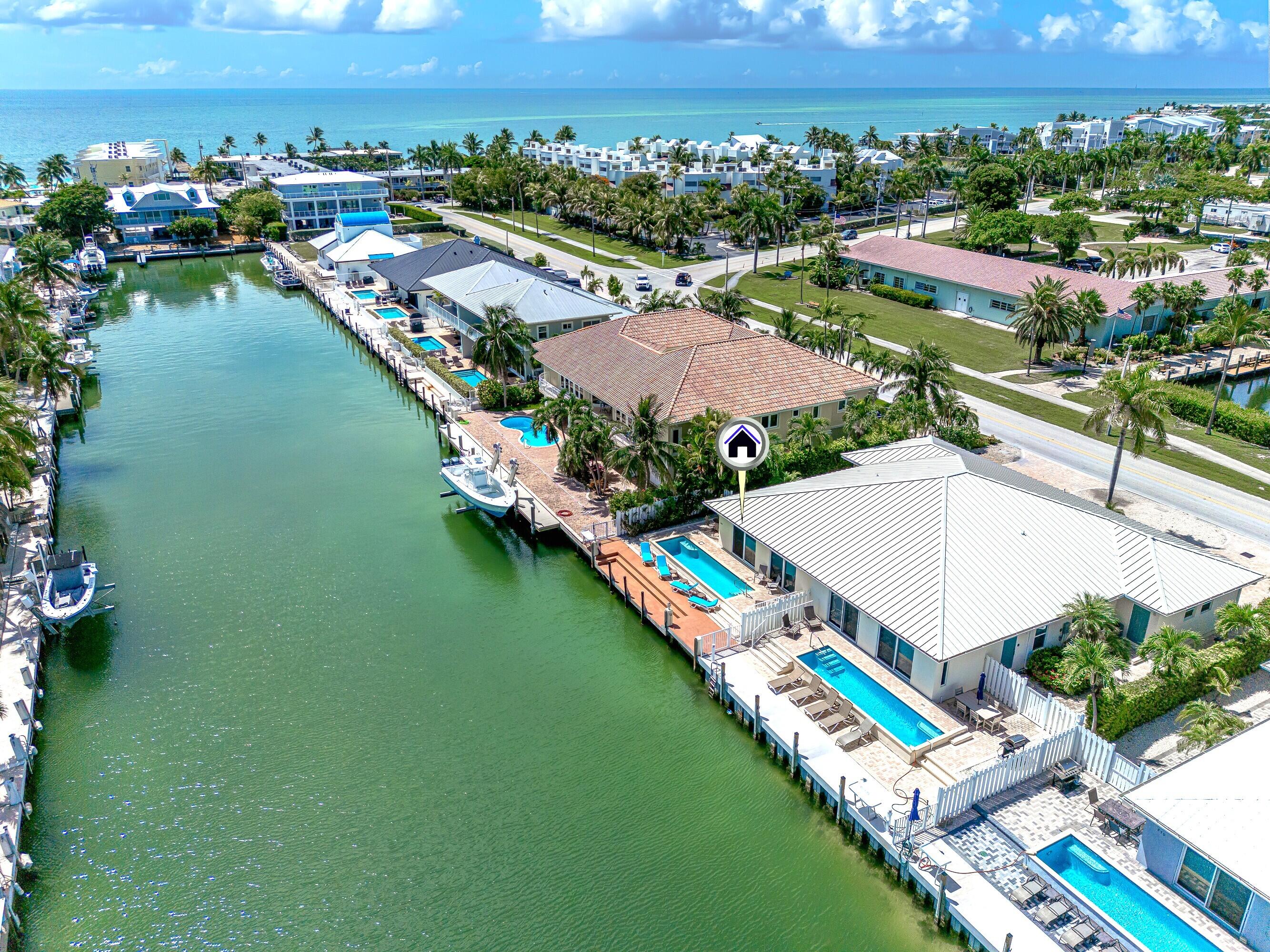 260 Sadowski Causeway Key Colony Beach, FL 33051 - Photo 26 of 50 a view of a city with lawn chairs