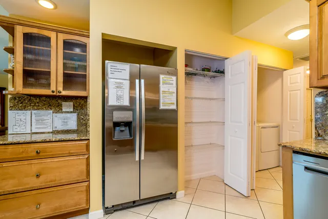 a dining room with furniture a window and kitchen view