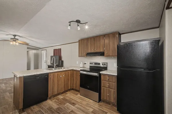 a kitchen with a stove and a sink