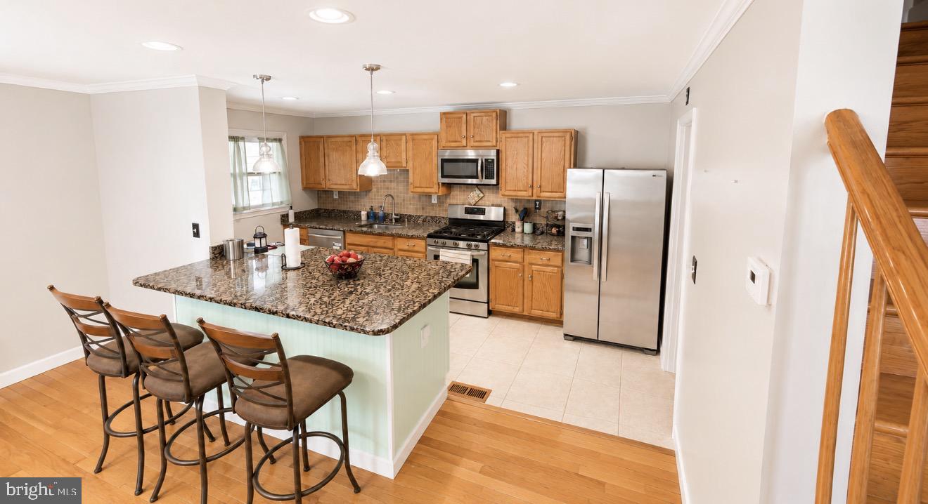 8027 Park Haven Road Dundalk, MD 21222 - Photo 6 of 13 Modern kitchen with inviting layout.
Edit with AI