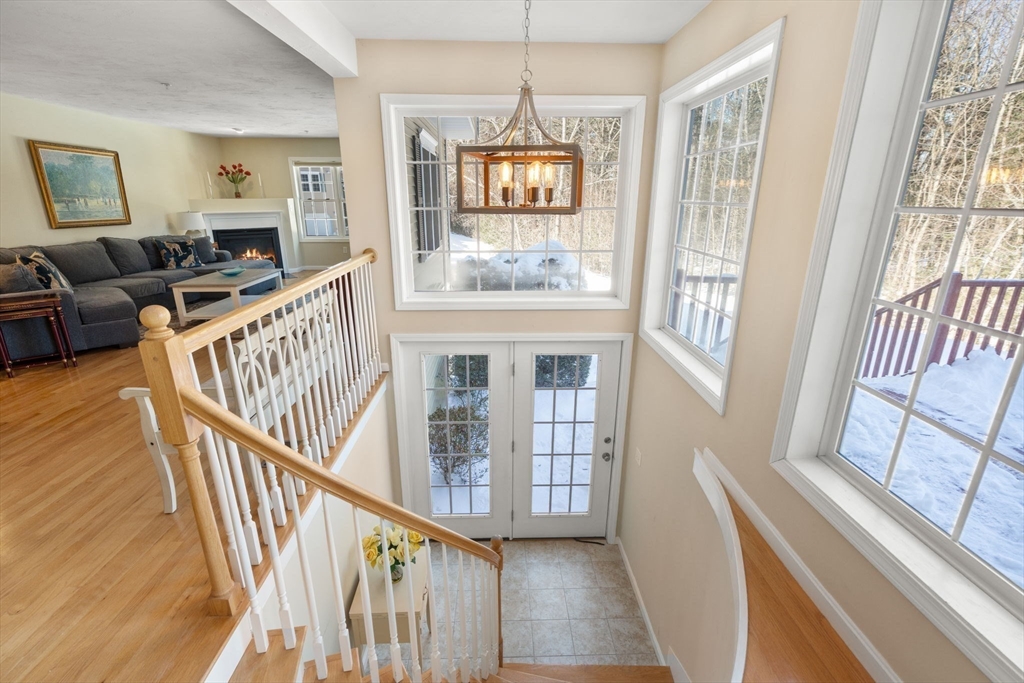 28 Patriots Boulevard, Unit 28 Hopkinton, MA 01748 - Photo 12 of 28 a view of an entryway with wooden floor and windows