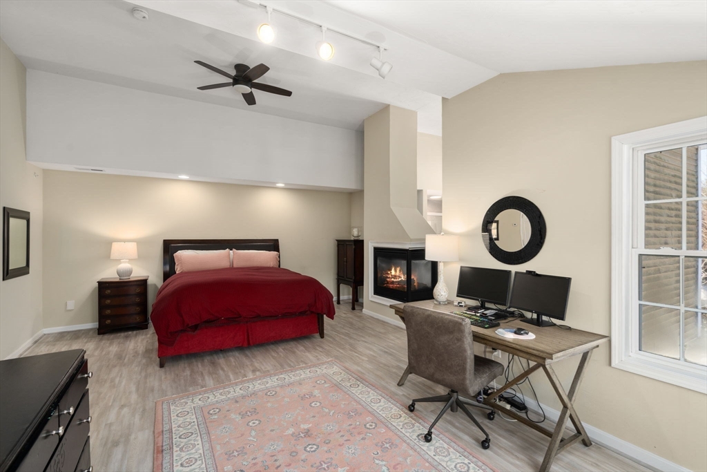 28 Patriots Boulevard, Unit 28 Hopkinton, MA 01748 - Photo 13 of 28 a bed room with a bed and a chair