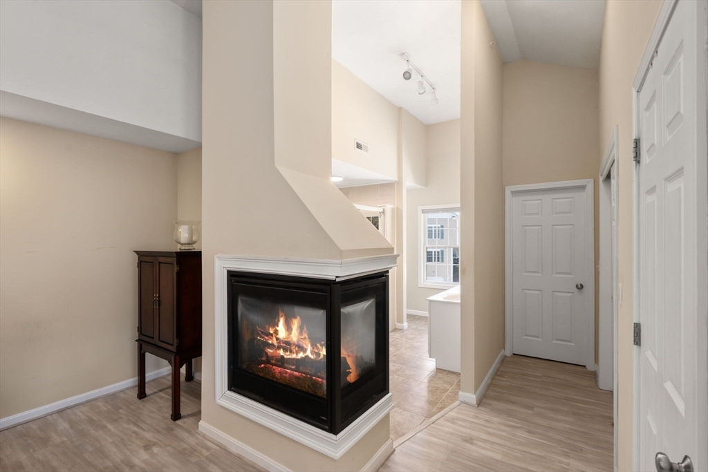 28 Patriots Boulevard, Unit 28 Hopkinton, MA 01748 - Photo 15 of 28 a living room with a fireplace