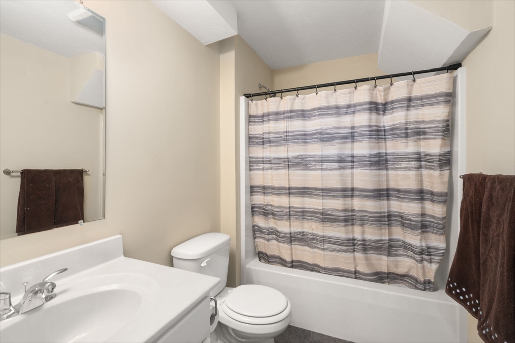 28 Patriots Boulevard, Unit 28 Hopkinton, MA 01748 - Photo 20 of 28 a bathroom with a sink toilet and shower