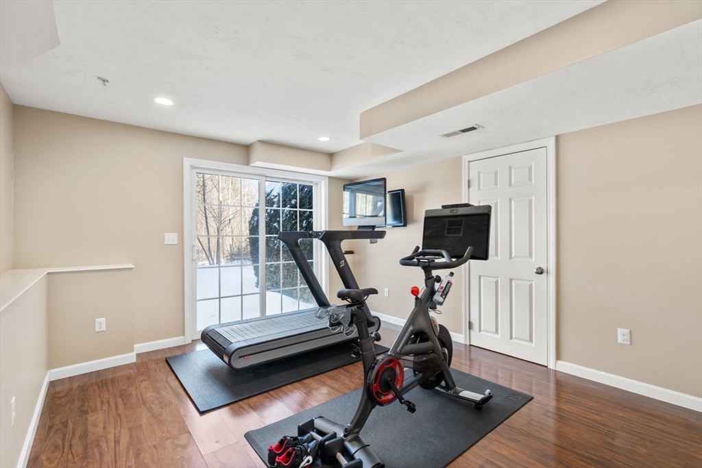 28 Patriots Boulevard, Unit 28 Hopkinton, MA 01748 - Photo 23 of 28 a view of a room with gym equipment