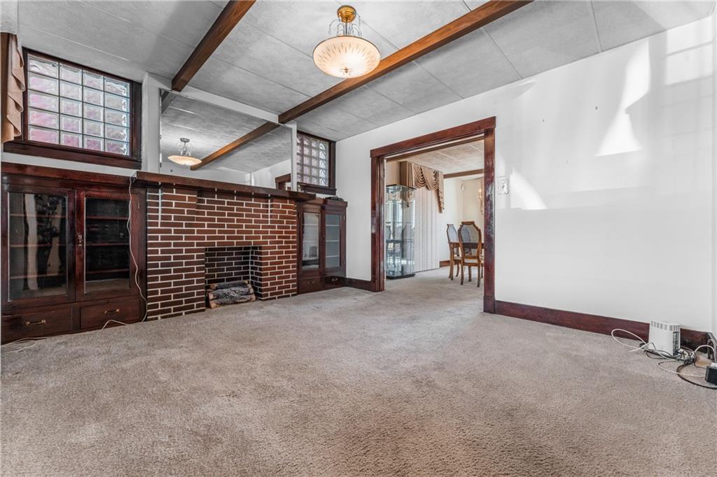 111 Sarah Street McKees Rocks, PA 15136 - Photo 13 of 30 a view of a livingroom with an empty space and a ceiling fan